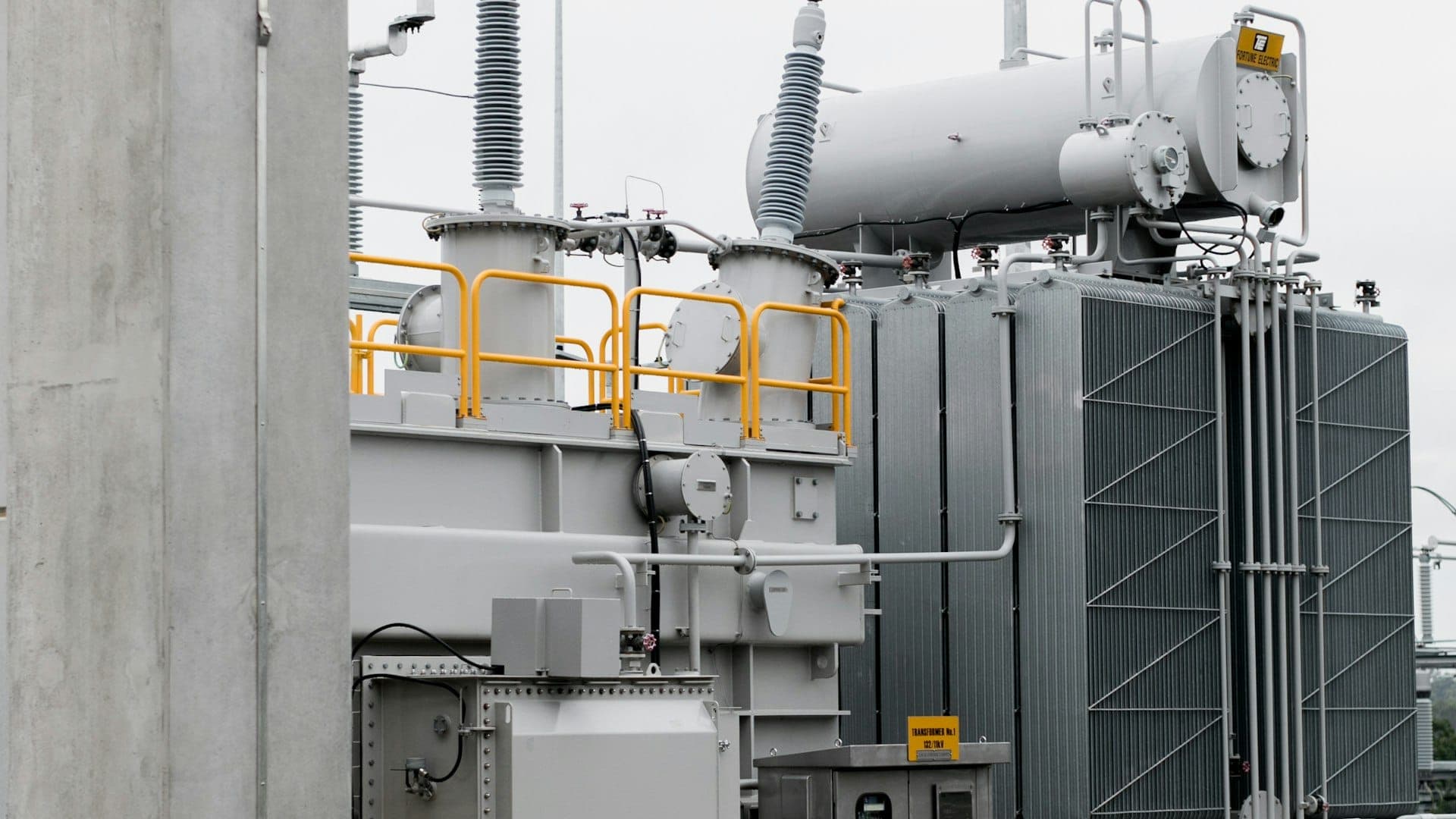 High-voltage grid at sunset